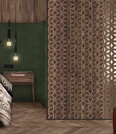 Chambre confortable avec murs en bois, literie à motifs, lampes suspendues modernes et paravent.